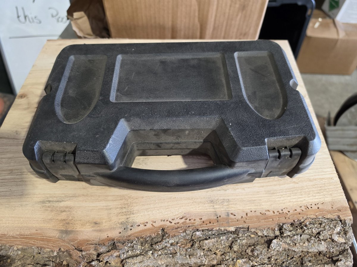 Black hard pistol case closed, handle and latches